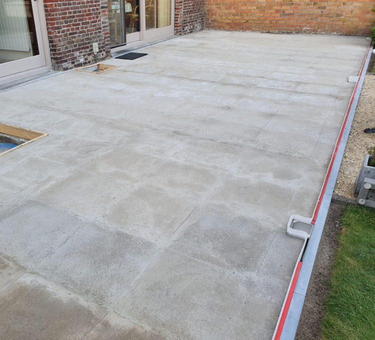 Terrace on sloping concrete slab with gutter