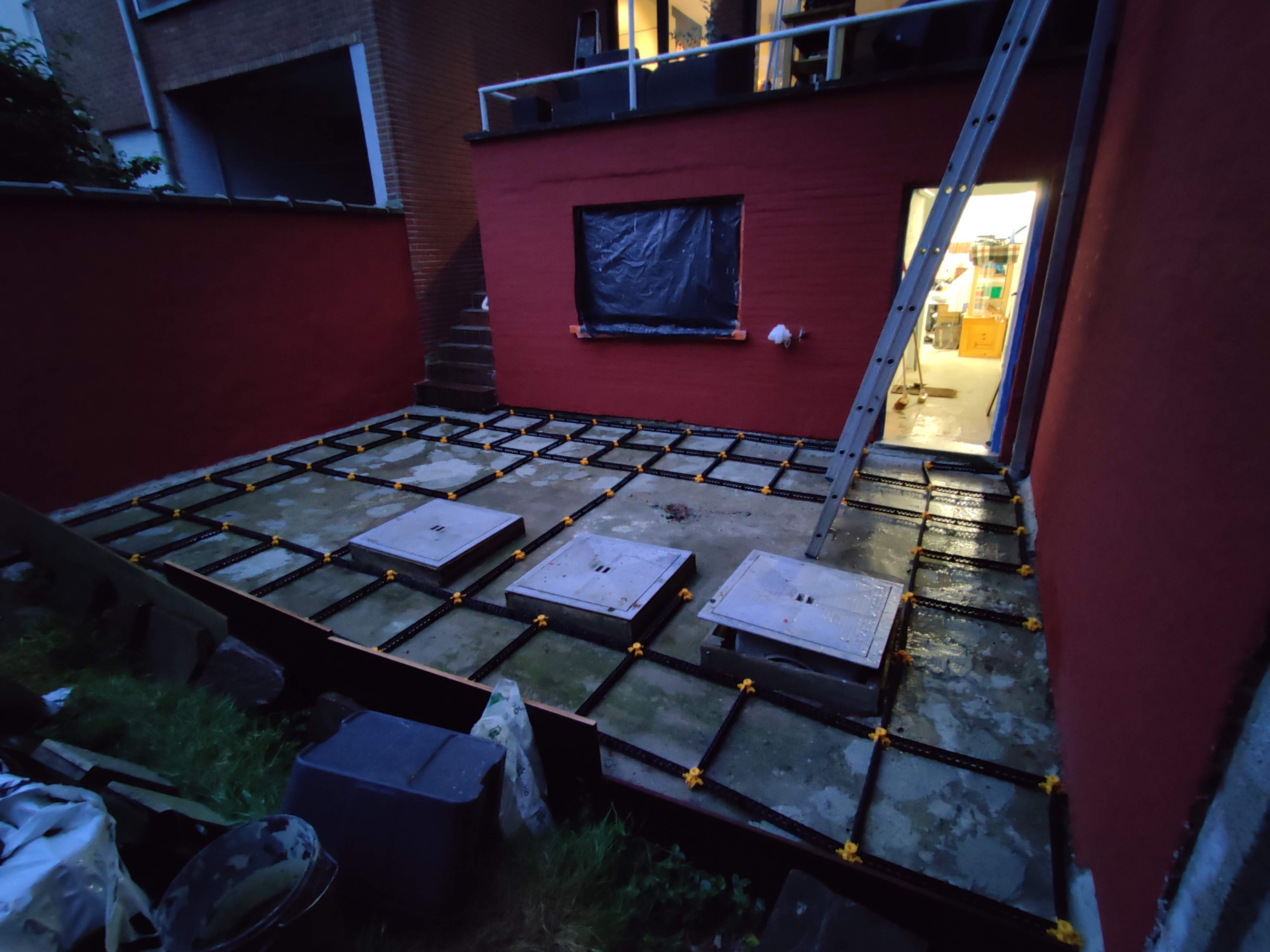 Terrace on sloping concrete slab with gutter