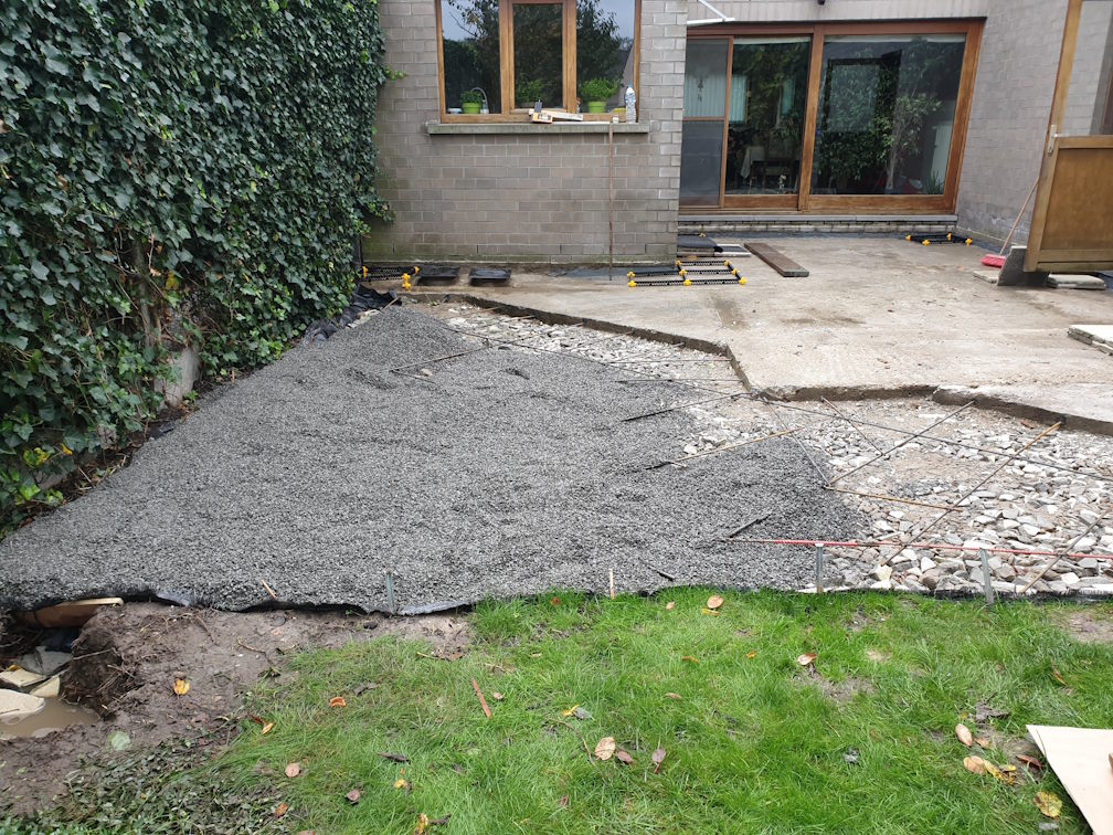 Terrace on sloping concrete slab with gutter