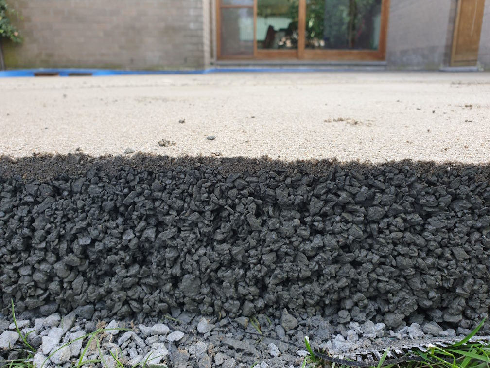 Terrace on sloping concrete slab with gutter