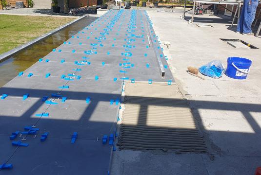 Gluing tiles on a terrace