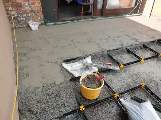 Staenisrooster terrasvloer op beton